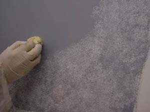 photo demonstrating how to apply the first coat of glaze for a stone faux finish