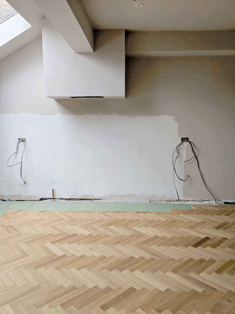 Laying parquet around kitchen units